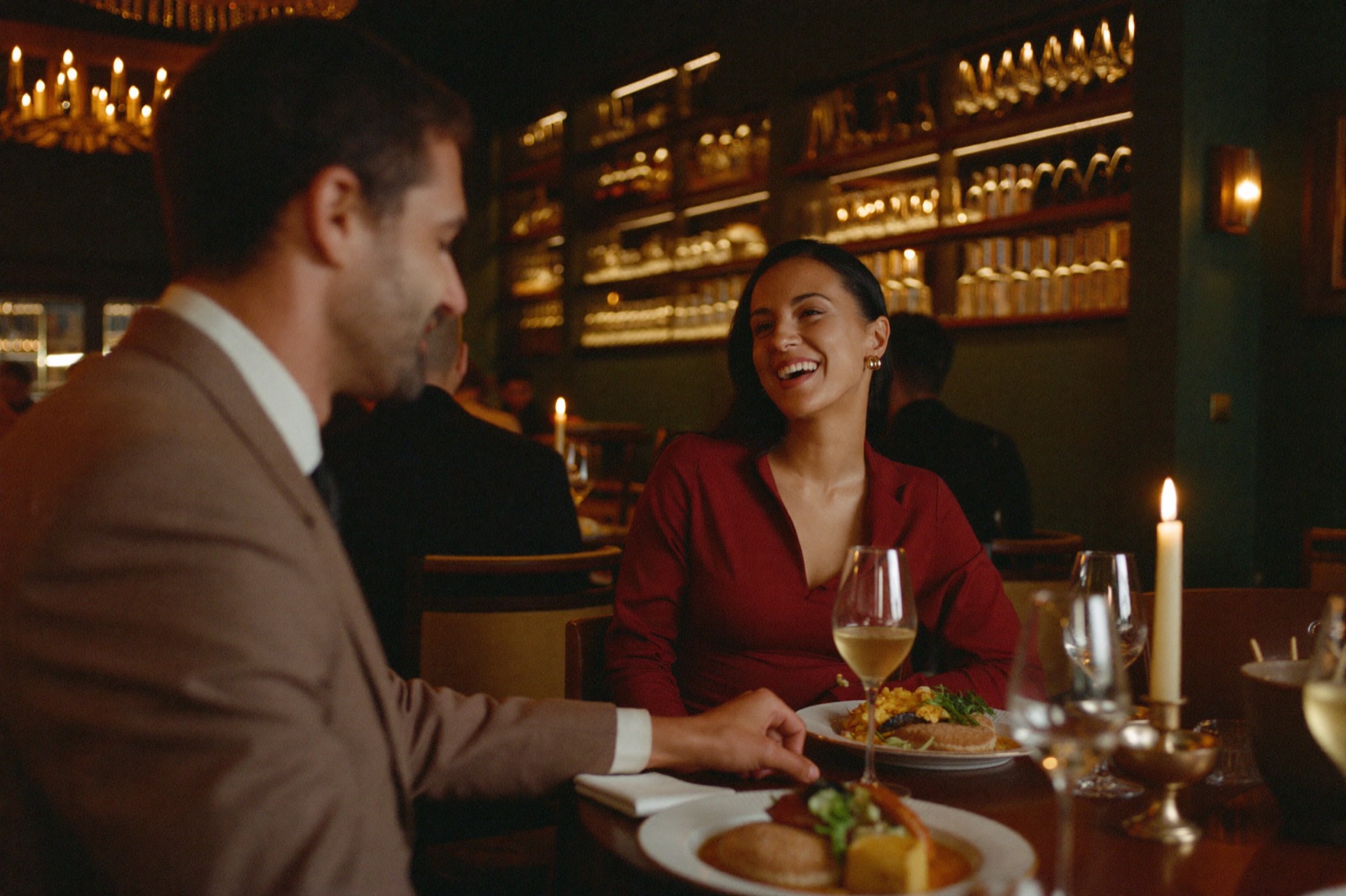 A couple locked in conversation over dinner